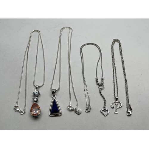 43 - FOUR SILVER NECKLACES