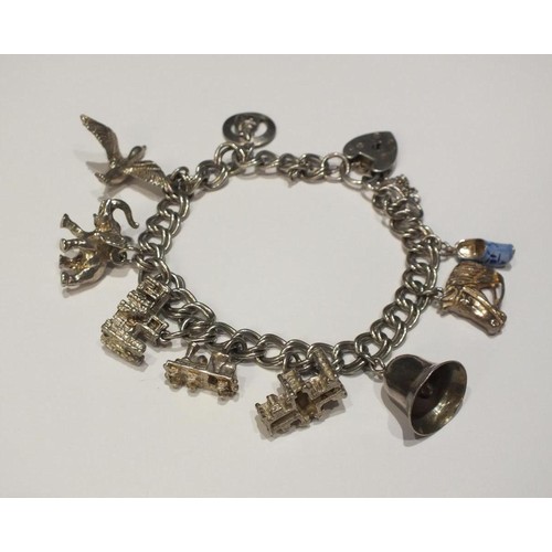 213 - SILVER CHARM BRACELET WITH 9 CHARMS