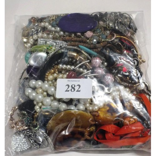 282 - TWO BAGS OF COSTUME JEWELLERY