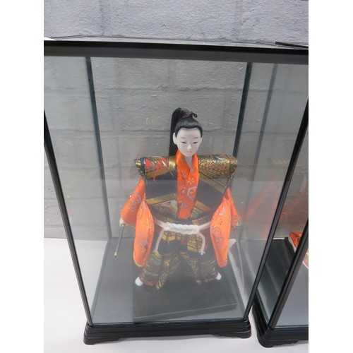 101 - TWO JAPANESE DOLLS WITH GLASS DISPLAY CASES - SAMURAI WARRIOR & GEISHA GIRL