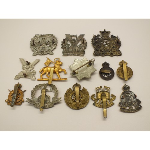 11 - TEN CAP BADGES