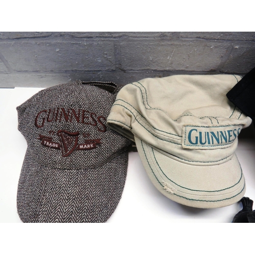 307 - TRAY OF GUINNESS HATS AND GUINNESS BADGES