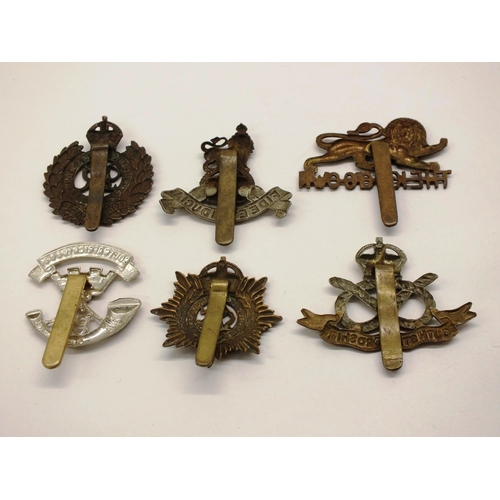 44 - SIX CAP BADGES