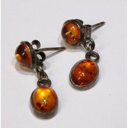 276 - TWO AMBER AND SILVER PENDANTS AND AMBER AND SILVER EARRINGS