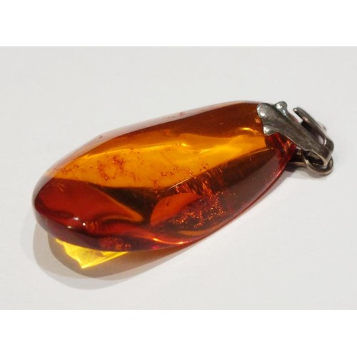 276 - TWO AMBER AND SILVER PENDANTS AND AMBER AND SILVER EARRINGS