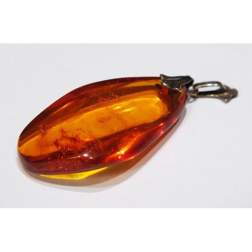 276 - TWO AMBER AND SILVER PENDANTS AND AMBER AND SILVER EARRINGS