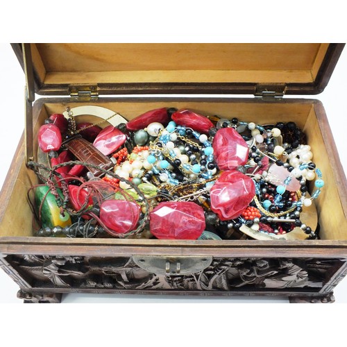 257 - HAND CARVED ANTIQUE JEWELLERY BOX FULL OF VINTAGE JEWELLERY