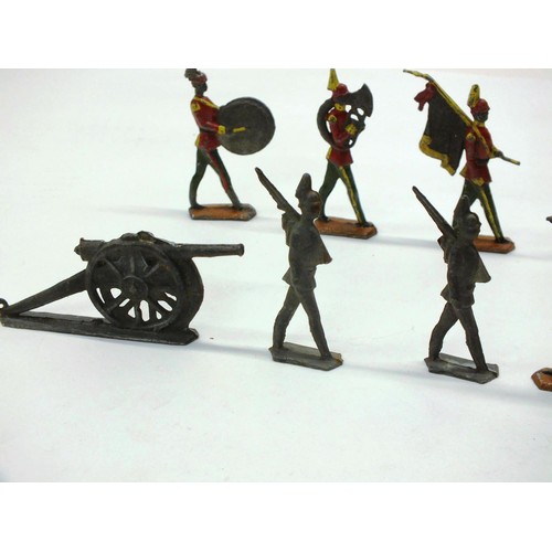 264 - TEN ANTIQUE LEAD SOLDIERS AND CANON