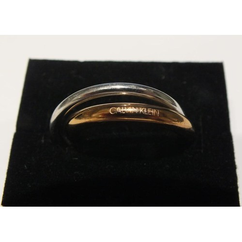 283 - CALVIN KLEIN SILVER AND ROSE GOLD TONE RING SIZE O