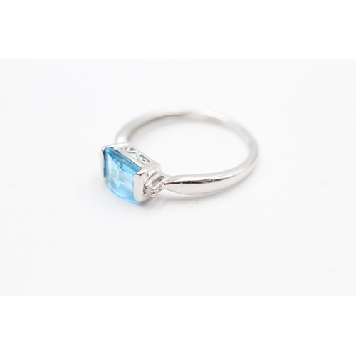 406 - 9ct white gold blue topaz & diamond three stone dress ring (2g) SIZE- O