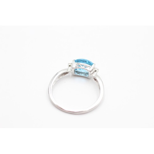 406 - 9ct white gold blue topaz & diamond three stone dress ring (2g) SIZE- O