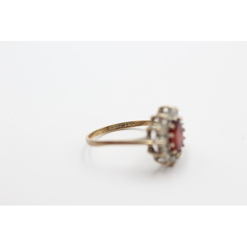 418 - 9ct gold garnet & clear gemstone halo dress ring (1.7g) SIZE- N