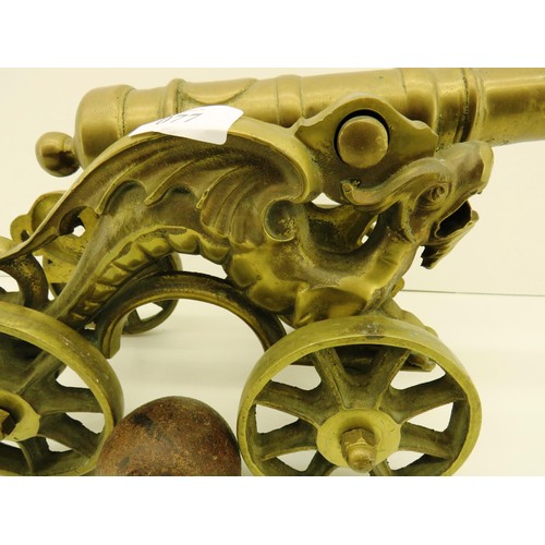 77 - LARGE BRASS CANNON AND ANTIQUE CANNONBALL