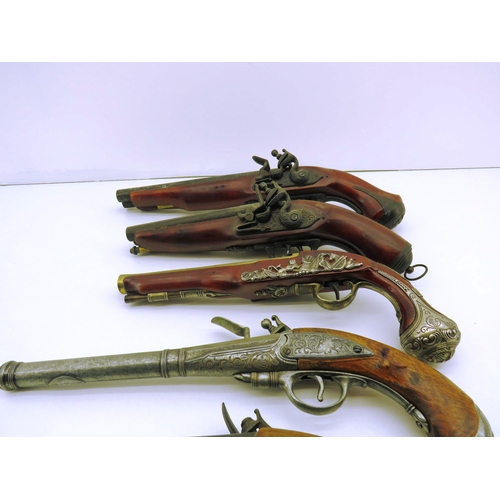 80 - EIGHT ORNAMENTAL FLINTLOCK PISTOLS