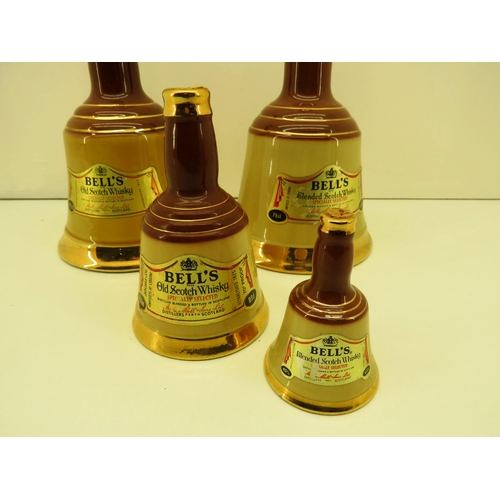 368 - FOUR ASSORTED SIZED WADE BELLS WHISKY DECANTER BOTTLES