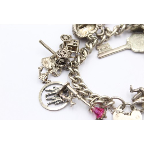 438 - .925 vintage charm bracelet with assorted charms (85g)