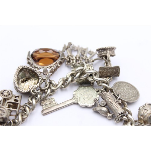 438 - .925 vintage charm bracelet with assorted charms (85g)