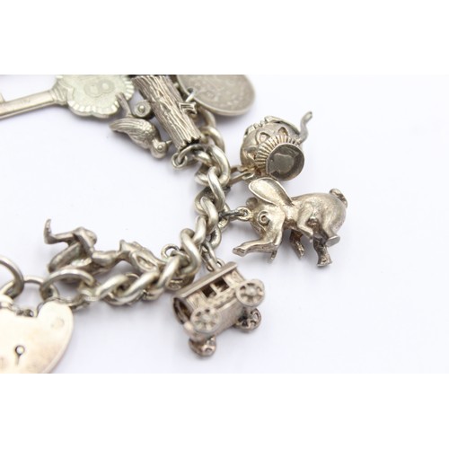 438 - .925 vintage charm bracelet with assorted charms (85g)