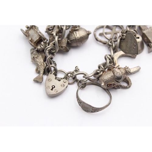 458 - .925 charm bracelet with assorted charms (71g)