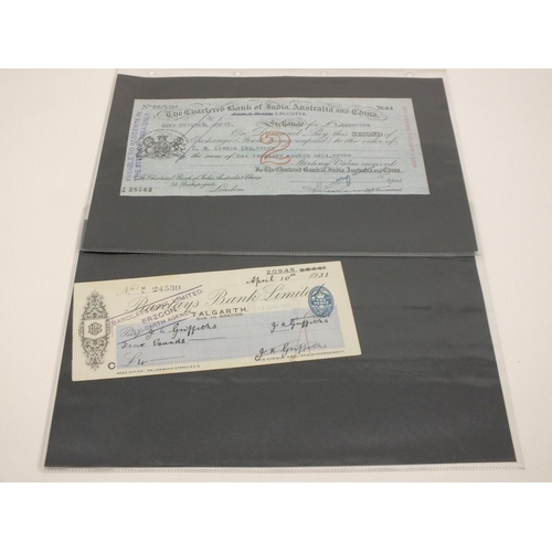 397 - FOLDER OF ANTIQUE AND VINTAGE CHEQUES