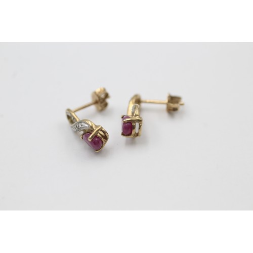 511 - 9ct gold diamond & ruby ornate drop earrings (1.4g)