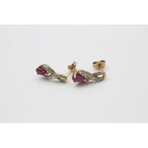 511 - 9ct gold diamond & ruby ornate drop earrings (1.4g)