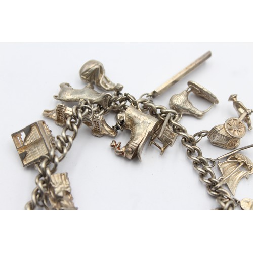 542 - .925 vintage charm bracelet with assorted charms (68g)