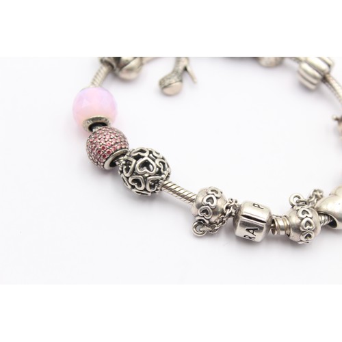 554 - .925 pandora bracelet with charms (54g)