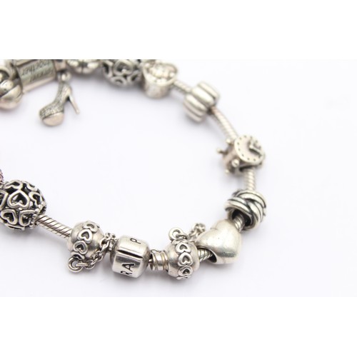 554 - .925 pandora bracelet with charms (54g)