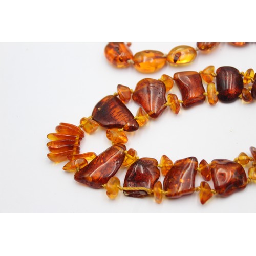 594 - 2 x amber bead necklaces including screw clasp (39g)