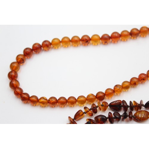 606 - 2 x amber necklaces (29g)