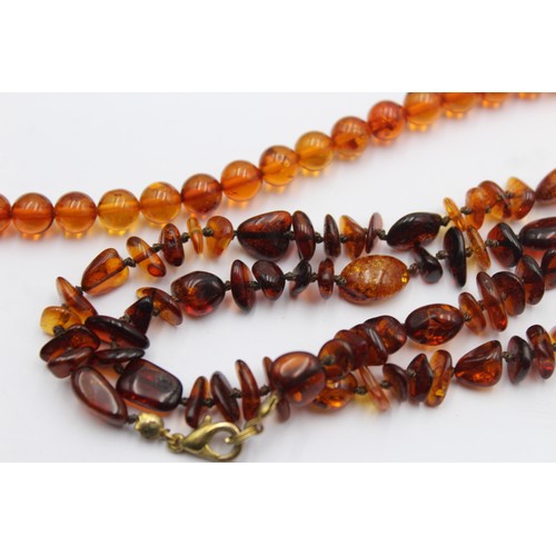 606 - 2 x amber necklaces (29g)