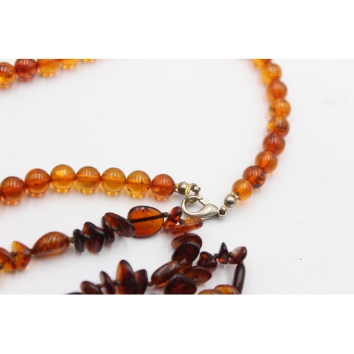 606 - 2 x amber necklaces (29g)