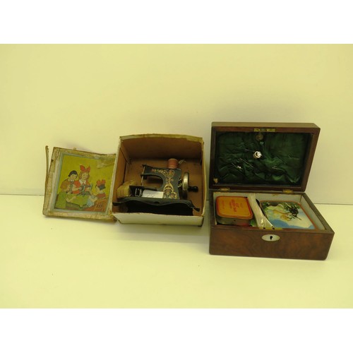 58 - ANTIQUE CHILDRENS SEWING MACHINE WITH ORNATE WOODEN SEWING BOX AND CONTENTS