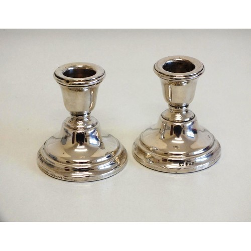 119 - PAIR OF STERLING SILVER SQUAT CANDLESTICKS - BASE FILLED, TOTAL WEIGHT 205g