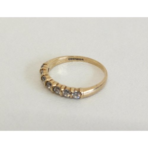 216 - 9CT GOLD RING - SEVEN CZ STONES - SIZE L, 1.7G