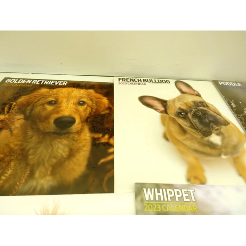 385 - SELECTION OF 2023 DOG CALENDARS