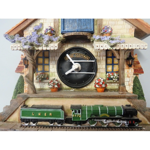 176 - FLYING SCOTSMAN CUCKOO CLOCK IN GOOD WORKING ORDER