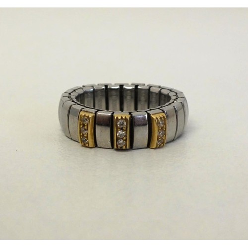 250 - GENUINE NOMINATION STRETCH RING 18ct GOLD and STEEL SIZE R