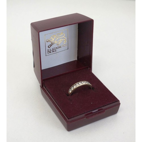 302 - LADIES 9CT GOLD NINE STONE RING