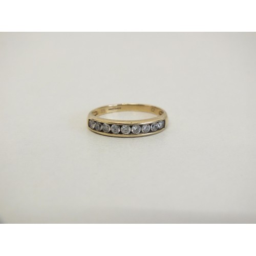 302 - LADIES 9CT GOLD NINE STONE RING