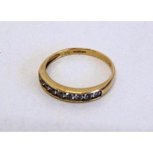 302 - LADIES 9CT GOLD NINE STONE RING