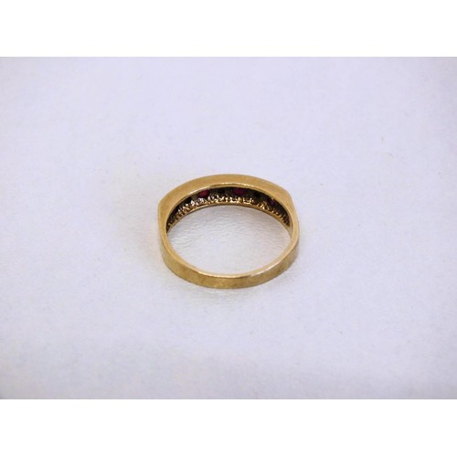 303 - LADIES 9CT GOLD SEVEN STONE RING