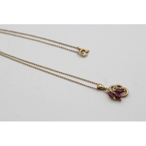 460 - 9ct gold diamond & ruby pendant necklace (1.8g)