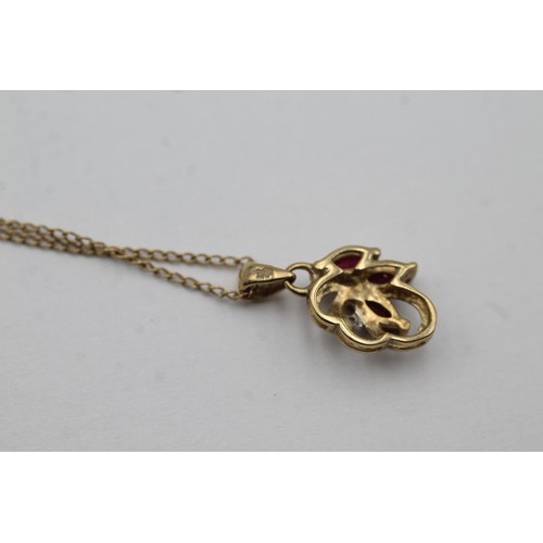 460 - 9ct gold diamond & ruby pendant necklace (1.8g)