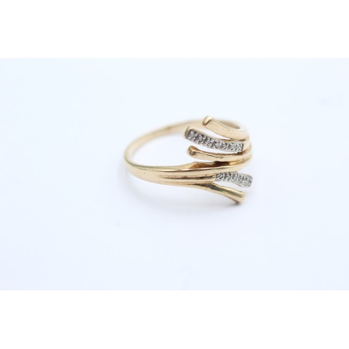 612 - 9ct gold diamond bypass ring (2.2g)- SIZE Q