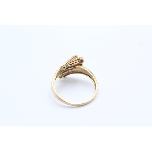 612 - 9ct gold diamond bypass ring (2.2g)- SIZE Q