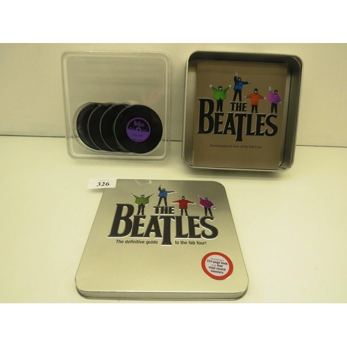 326 - THE BEATLES TIN WITH 224 PAGE BOOK AND FOUR VINYL RECORD COASTERS