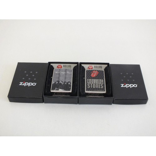 323 - TWO VINTAGE ROLLING STONES ZIPPO LIGHTERS- BOXED