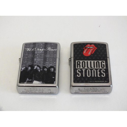 323 - TWO VINTAGE ROLLING STONES ZIPPO LIGHTERS- BOXED